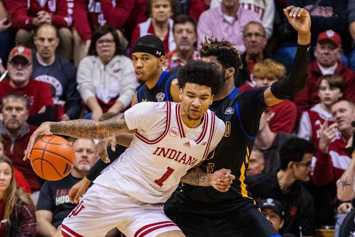 Dec 19, 2023; Bloomington, Indiana, USA; Indiana Hoosiers center Kel'el Ware (1) dribbles the ball while Morehead State Eagles forward Dieonte Miles (23) defends in the second half at Simon Skjodt Assembly Hall. Mandatory Credit: Trevor Ruszkowski-USA TODAY Sports